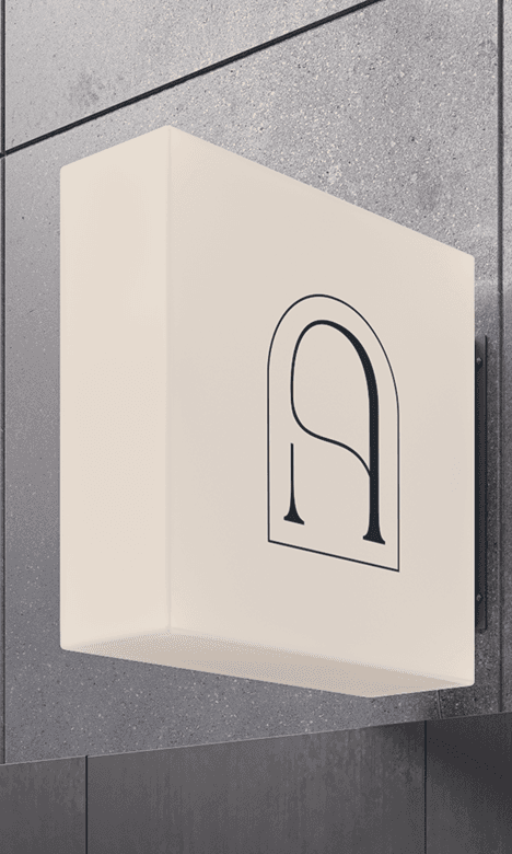 TAVÚ lightbox sign on a wall